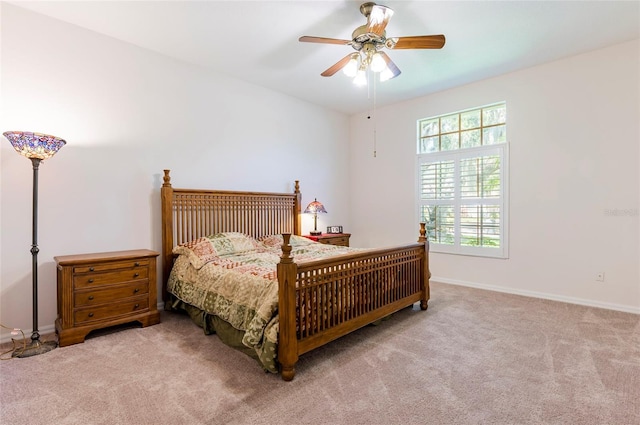 9908 Alafia River Ln, Gibsonton, FL 33534 - carpeted bedroom with baseboards and a ceiling fan