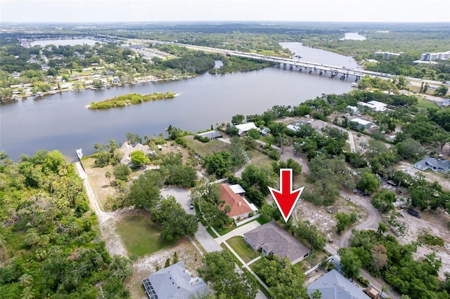 9908 Alafia River Ln, Gibsonton, FL 33534 - aerial overview of property's location with a large body of water, a notable bridge, and nearby suburban area