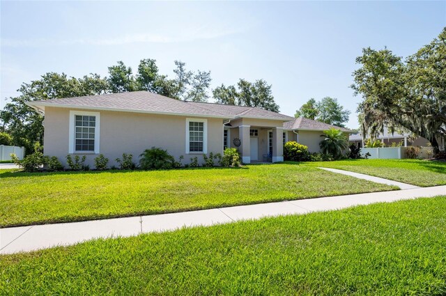 9908 Alafia River Ln, Gibsonton, FL 33534 - ranch-style house with stucco siding