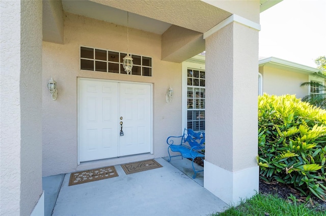 9908 Alafia River Ln, Gibsonton, FL 33534 - doorway to property featuring stucco siding