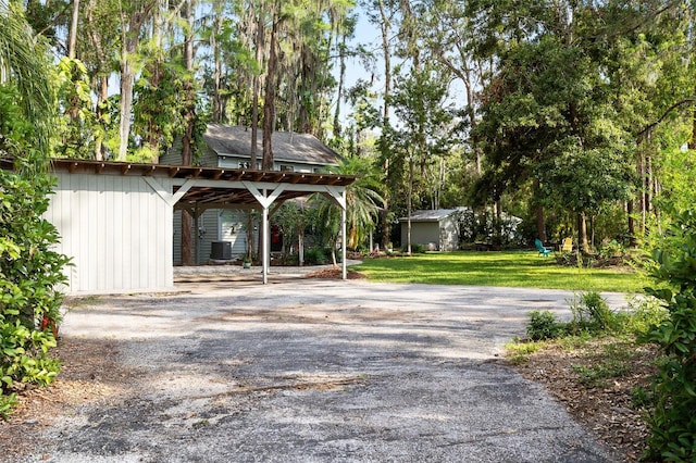 22004 Dupree Dr, Land O Lakes, FL 34639 - exterior space featuring driveway and central AC