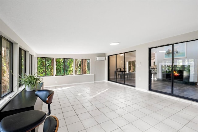 22004 Dupree Dr, Land O Lakes, FL 34639 - living area with light tile patterned floors, a wall unit AC, and baseboards
