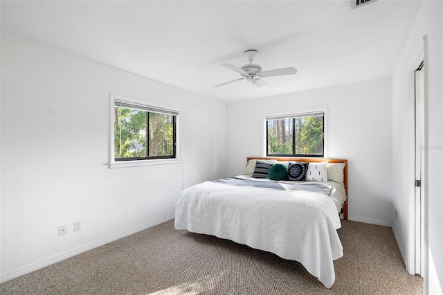 22004 Dupree Dr, Land O Lakes, FL 34639 - bedroom featuring carpet floors, baseboards, and ceiling fan
