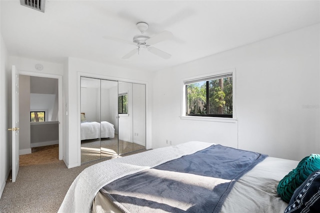 22004 Dupree Dr, Land O Lakes, FL 34639 - carpeted bedroom featuring multiple windows, a closet, a ceiling fan, and baseboards