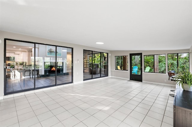 22004 Dupree Dr, Land O Lakes, FL 34639 - unfurnished living room featuring light tile patterned flooring, healthy amount of natural light, baseboards, and recessed lighting