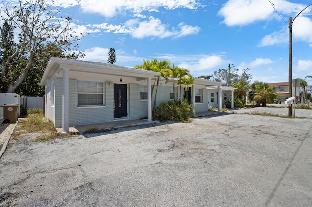 154 147th Ave E, Madeira Beach, FL 33708 - view of front of house featuring brick siding