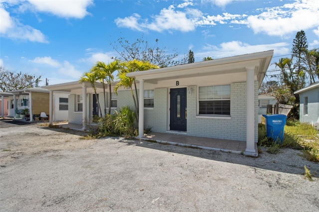 154 147th Ave E, Madeira Beach, FL 33708 - view of front of property featuring brick siding