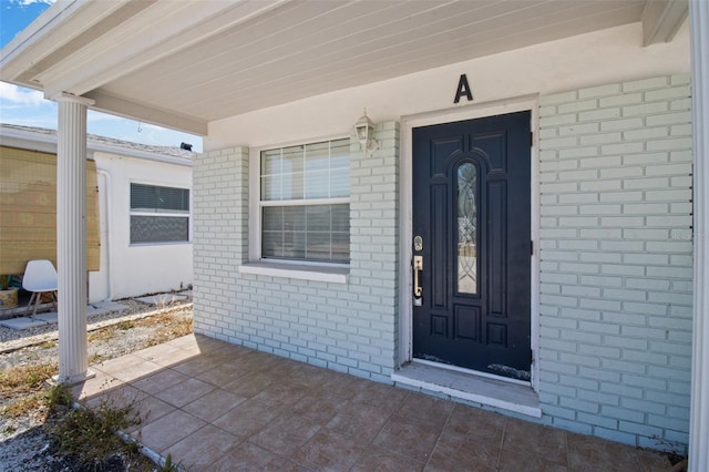 154 147th Ave E, Madeira Beach, FL 33708 - property entrance featuring brick siding