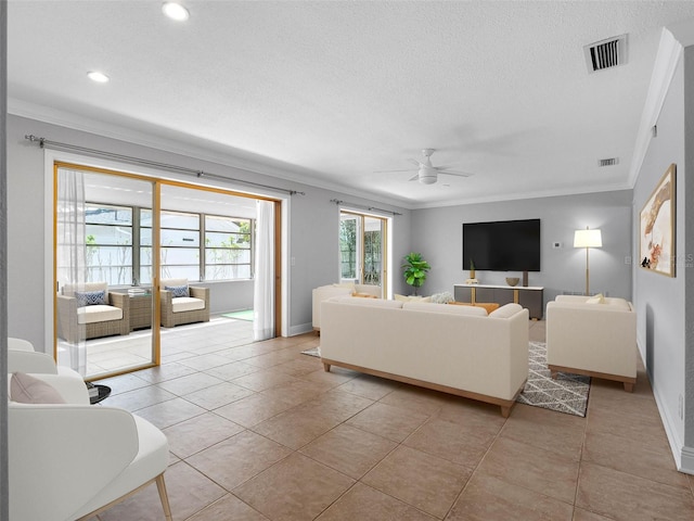 1701 38th St N, Saint Petersburg, FL 33713 - living room featuring crown molding, a ceiling fan, baseboards, a textured ceiling, and light tile patterned flooring