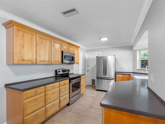 1701 38th St N, Saint Petersburg, FL 33713 - kitchen featuring stainless steel appliances, a sink, ornamental molding, dark countertops, and light tile patterned floors