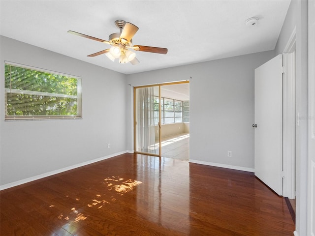 1701 38th St N, Saint Petersburg, FL 33713 - unfurnished room with ceiling fan, wood finished floors, a smoke detector, and baseboards