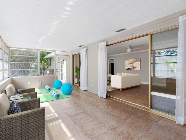 1701 38th St N, Saint Petersburg, FL 33713 - workout area featuring ceiling fan, tile patterned flooring, and baseboards