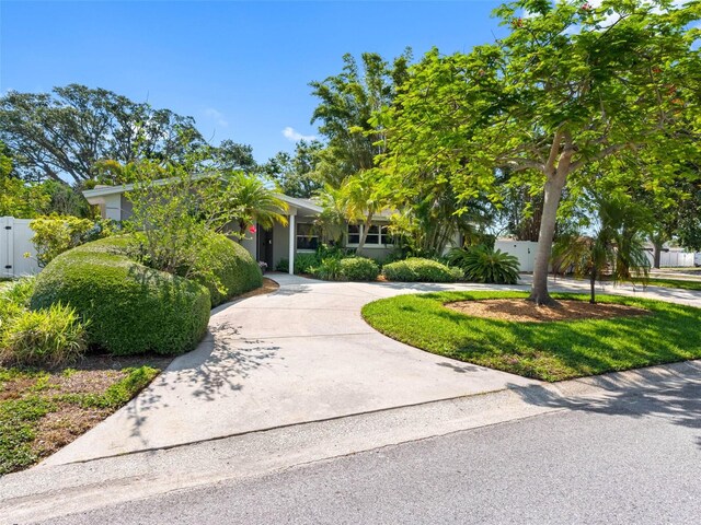 1701 38th St N, Saint Petersburg, FL 33713 - obstructed view of property with curved driveway