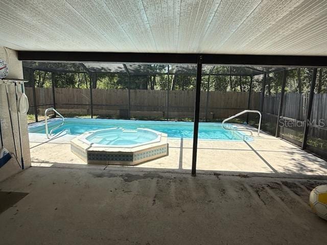 10811 Candlin Ct, Riverview, FL 33578 - view of swimming pool featuring a fenced backyard, a patio, a lanai, and a pool with connected hot tub