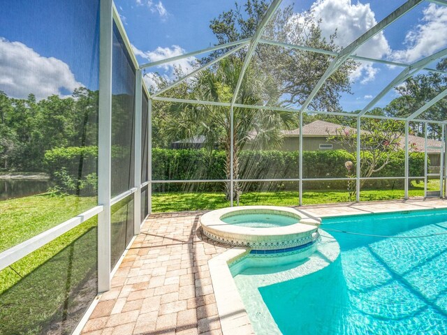 3910 Saywood Ct, Palm Harbor, FL 34685 - view of pool featuring a pool with connected hot tub, a lanai, a patio area, and a lawn