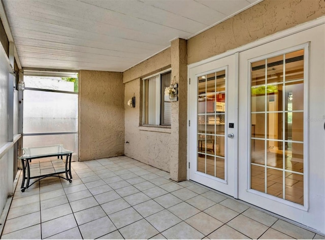 1877 Pine Cone Cir, Clearwater, FL 33760 - unfurnished sunroom with french doors