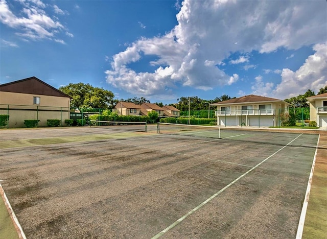 1877 Pine Cone Cir, Clearwater, FL 33760 - view of tennis court featuring a residential view