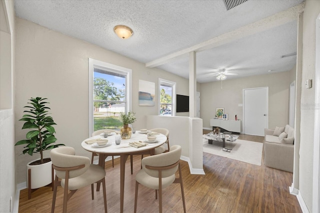 4804 N 18th St, Tampa, FL 33610 - dining room featuring wood finished floors, a textured ceiling, baseboards, and ceiling fan