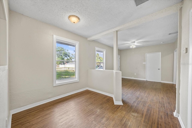 4804 N 18th St, Tampa, FL 33610 - unfurnished room featuring wood finished floors, baseboards, a textured ceiling, and ceiling fan