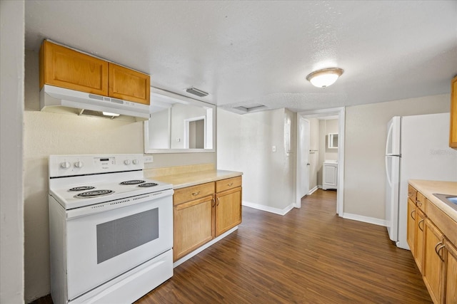 4804 N 18th St, Tampa, FL 33610 - kitchen with white appliances, under cabinet range hood, dark wood-style floors, light countertops, and baseboards