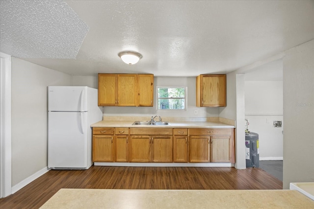 4804 N 18th St, Tampa, FL 33610 - kitchen featuring freestanding refrigerator, a sink, dark wood-type flooring, light countertops, and brown cabinets