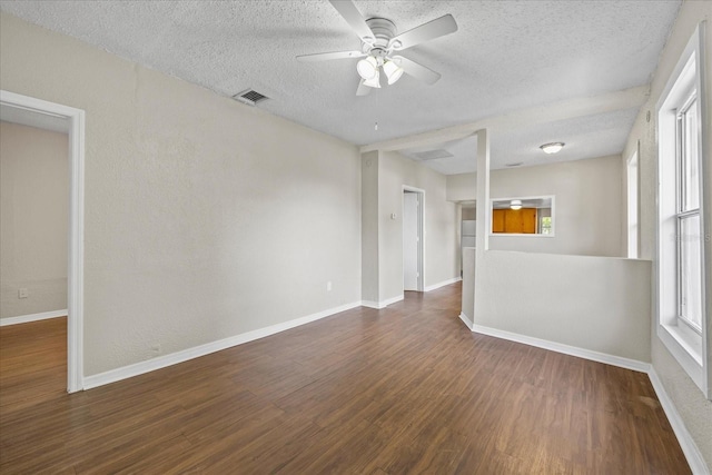 4804 N 18th St, Tampa, FL 33610 - spare room featuring a textured ceiling, wood finished floors, ceiling fan, and baseboards