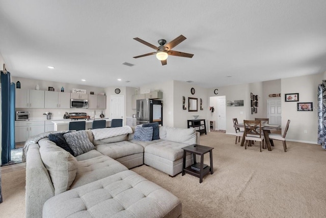 14643 Brumby Ridge Ave, Lithia, FL 33547 - living area with ceiling fan, light colored carpet, baseboards, and recessed lighting