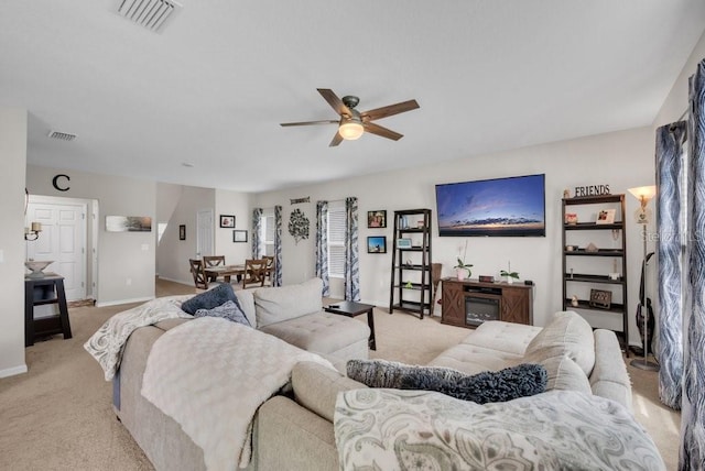 14643 Brumby Ridge Ave, Lithia, FL 33547 - living room featuring a ceiling fan, light carpet, and baseboards