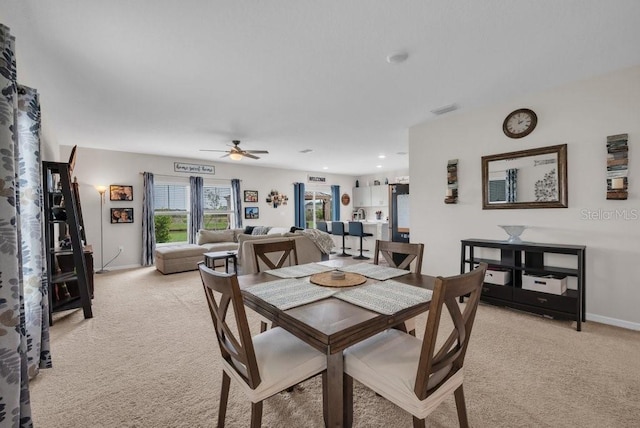 14643 Brumby Ridge Ave, Lithia, FL 33547 - dining room featuring light carpet, a ceiling fan, baseboards, and recessed lighting