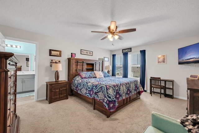 14643 Brumby Ridge Ave, Lithia, FL 33547 - bedroom with light colored carpet, a textured ceiling, connected bathroom, and baseboards
