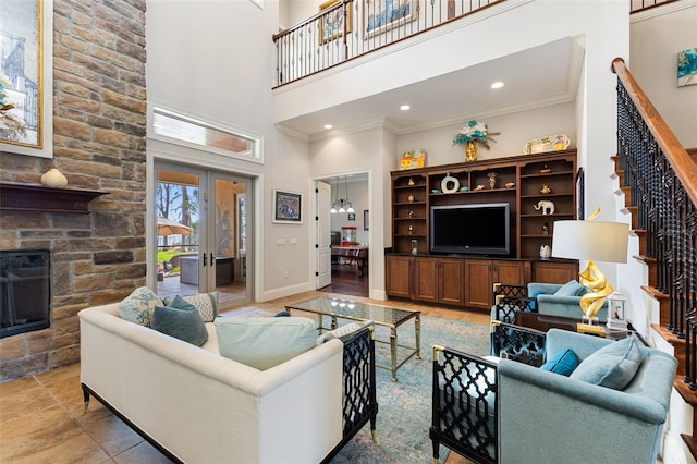 18258 Wayne Rd, Odessa, FL 33556 - living room with stairway, a towering ceiling, a fireplace, crown molding, and french doors