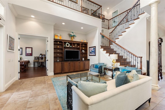 18258 Wayne Rd, Odessa, FL 33556 - living room featuring stairway, a towering ceiling, crown molding, recessed lighting, and ornate columns