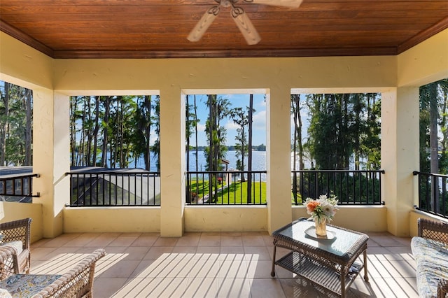 18258 Wayne Rd, Odessa, FL 33556 - sunroom / solarium with a water view, a ceiling fan, wooden ceiling, tile patterned floors, and crown molding
