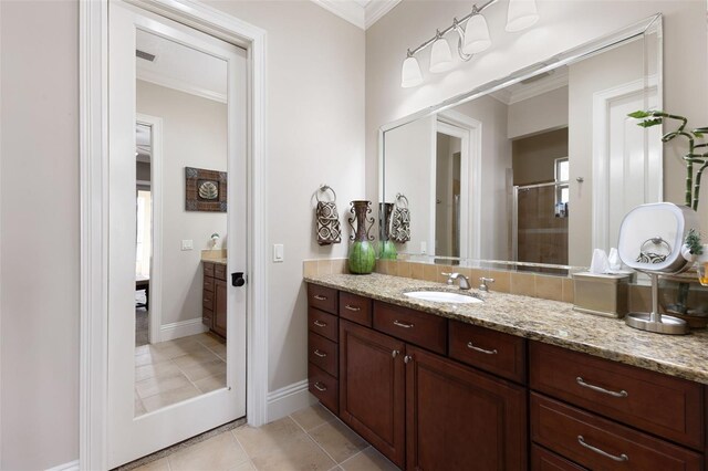 18258 Wayne Rd, Odessa, FL 33556 - full bathroom featuring vanity, ornamental molding, a stall shower, tile patterned floors, and baseboards