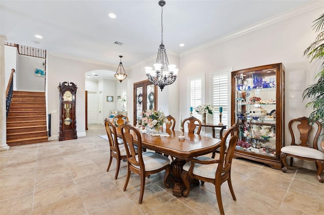 18258 Wayne Rd, Odessa, FL 33556 - dining space featuring arched walkways, stairway, a chandelier, recessed lighting, and ornamental molding