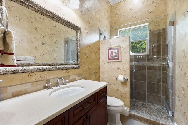 18258 Wayne Rd, Odessa, FL 33556 - full bathroom with toilet, vanity, a shower stall, wallpapered walls, and tile patterned flooring