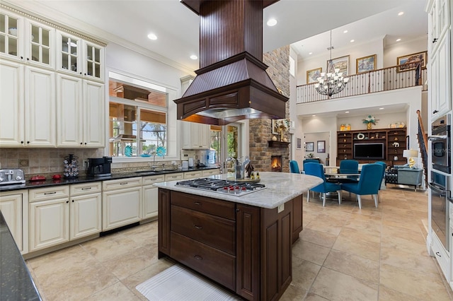 18258 Wayne Rd, Odessa, FL 33556 - kitchen with stainless steel appliances, ornamental molding, a chandelier, a high ceiling, and decorative backsplash