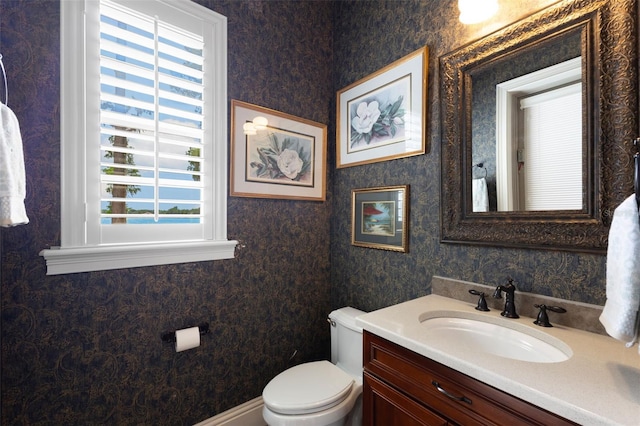 18258 Wayne Rd, Odessa, FL 33556 - half bathroom with wallpapered walls, vanity, and toilet