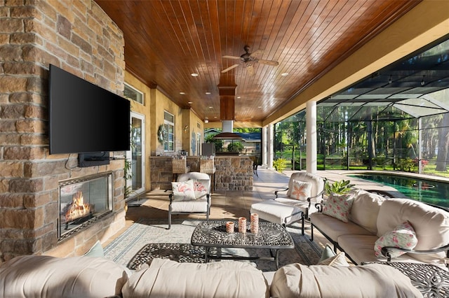 18258 Wayne Rd, Odessa, FL 33556 - view of patio / terrace with an outdoor living space with a fireplace and a ceiling fan