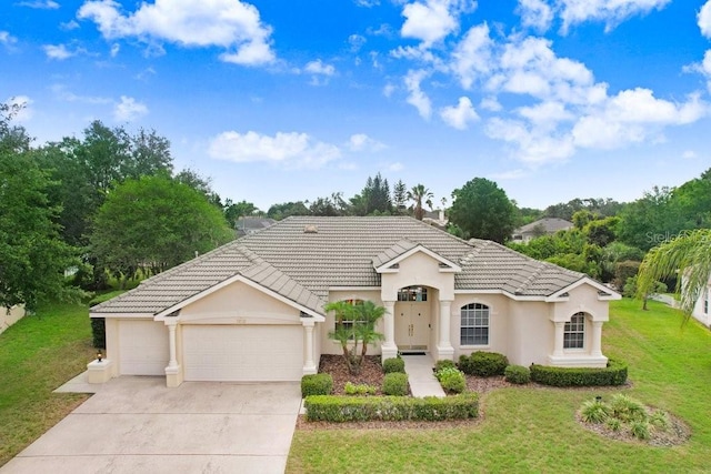 1212 Baycove Ln, Lutz, FL 33549 - view of front of home featuring stucco siding, a garage, driveway, a front yard, and a tiled roof
