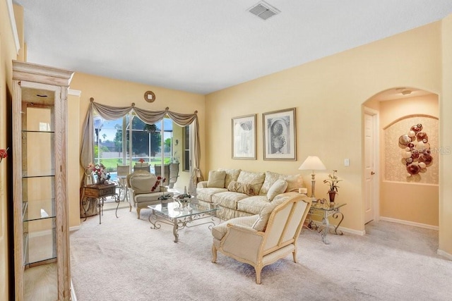 1212 Baycove Ln, Lutz, FL 33549 - living area with arched walkways, carpet, and baseboards