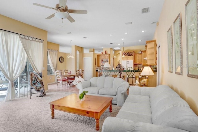 1212 Baycove Ln, Lutz, FL 33549 - living area featuring a ceiling fan and light carpet