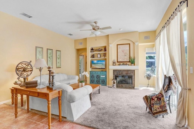 1212 Baycove Ln, Lutz, FL 33549 - living area with ceiling fan, a fireplace, built in shelves, and baseboards