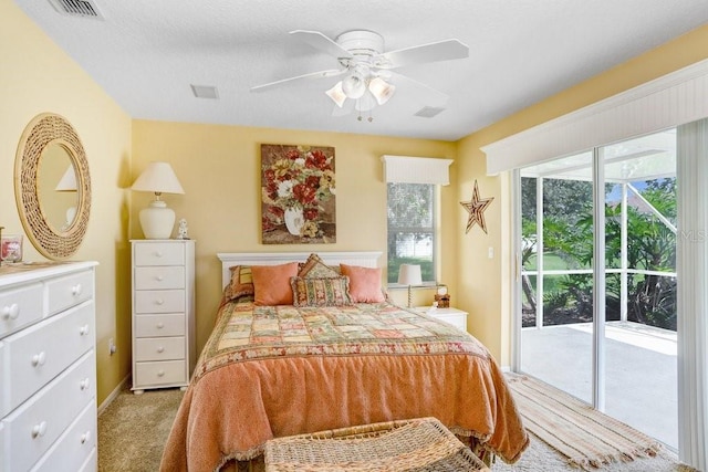 1212 Baycove Ln, Lutz, FL 33549 - carpeted bedroom featuring access to outside and a ceiling fan