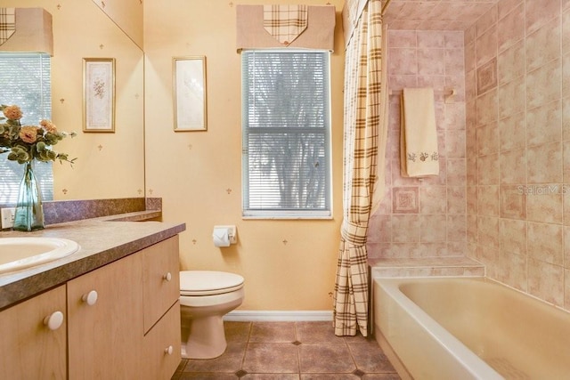 1212 Baycove Ln, Lutz, FL 33549 - full bath featuring tile patterned floors, vanity, toilet, shower / tub combo, and baseboards