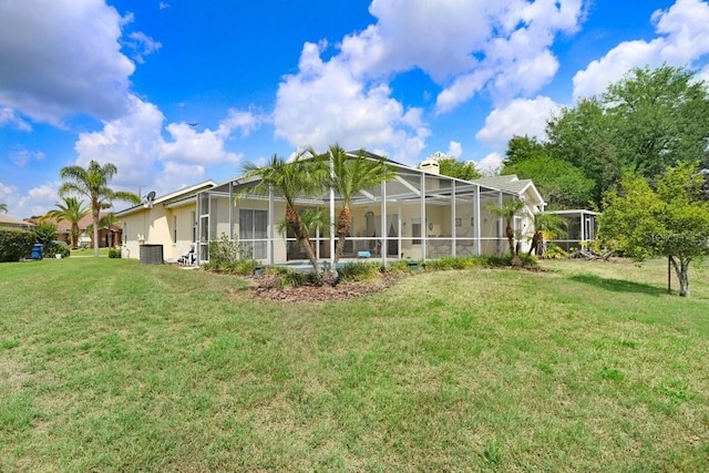1212 Baycove Ln, Lutz, FL 33549 - rear view of property with a lawn, central air condition unit, and a lanai