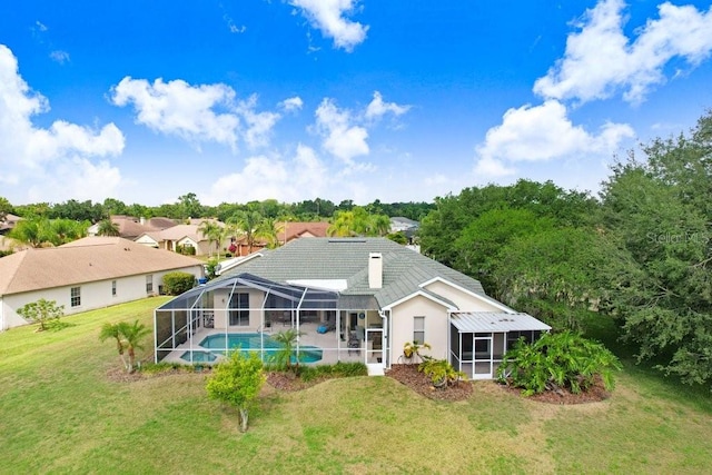 1212 Baycove Ln, Lutz, FL 33549 - back of property featuring a yard, a lanai, and a pool with connected hot tub
