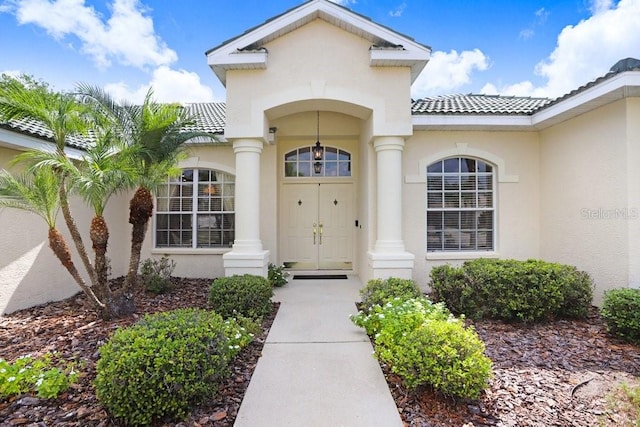 1212 Baycove Ln, Lutz, FL 33549 - entrance to property with stucco siding and a tiled roof