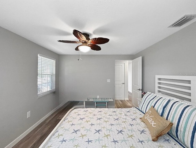 10011 46th Ave W, Bradenton, FL 34210 - bedroom featuring wood finished floors, baseboards, and ceiling fan