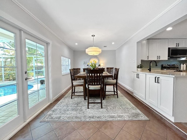10011 46th Ave W, Bradenton, FL 34210 - dining room featuring ornamental molding, dark tile patterned floors, recessed lighting, and baseboards